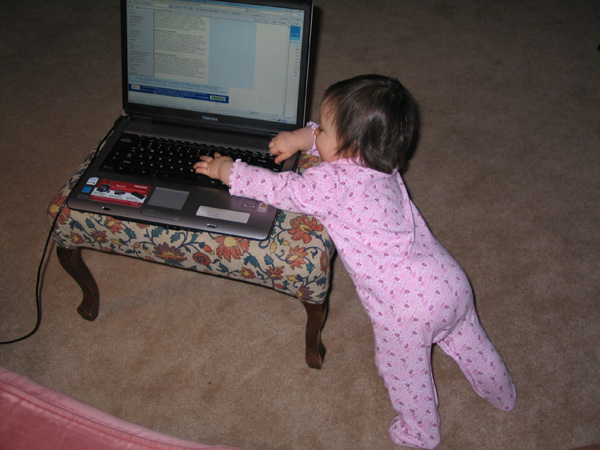 Megan Keating blogging on the laptop